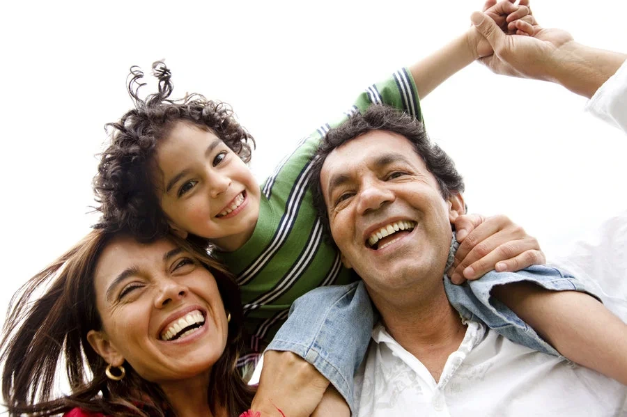 A family sharing a joyful moment together, illustrating the PresentChild method